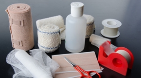 Different rolls of medical bandages and care equipment