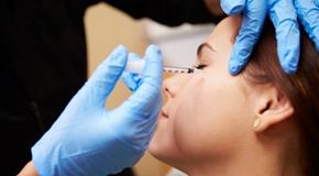 Woman Having Botox Treatment At Beauty Clinic