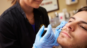 Man Having Botox Treatment At Beauty Clinic