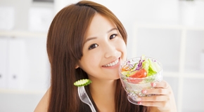 beautiful asian young woman eating healthy food