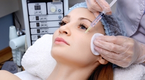 Doctor woman giving botox injections.