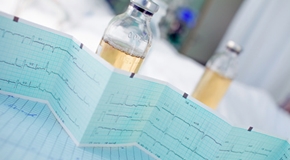 ECG and bottles on table in ward