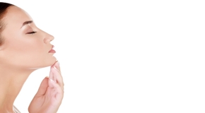 Woman touches her chin, white background