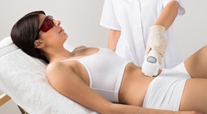 Young Woman Receiving Laser Treatment On Belly