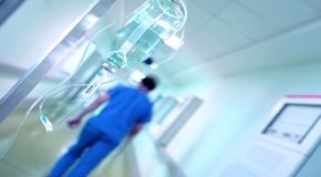 Drip against a blurred hospital corridor
