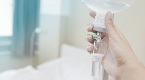 Close up saline IV drip for patient and Infusion pump in hospita